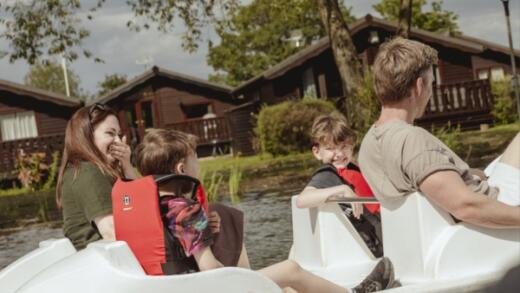 Family at cotswold riding pedalo