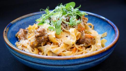 The venue food image  SLOW COOKED VENISON RAGU