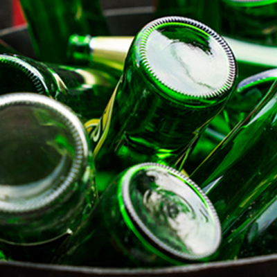 Glass bottles in bin