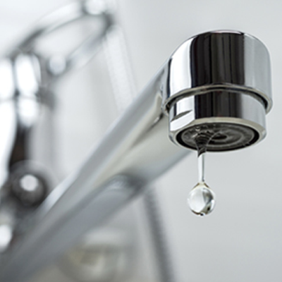 Close up of water coming out of tap