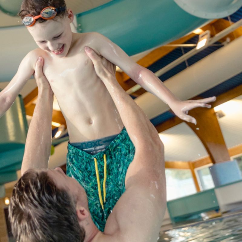 Heated pool with flume