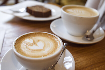 Coffees and cake on table