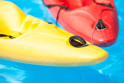Red and yellow kayaks in water