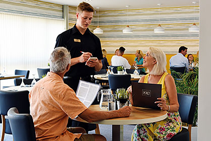 Couple being served in Bashley brasserie