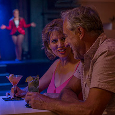 Couple enjoying a drink and evening entertainment