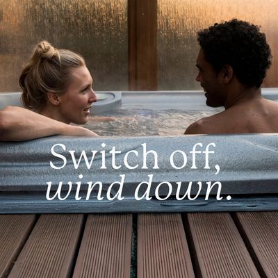 a couple relaxing in hot tub