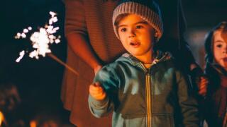 Boy holding sparkler