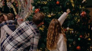 Family with a Christmas tree
