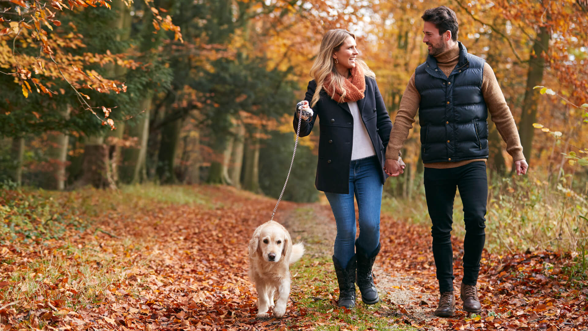 Couple walking in New Forest during winter