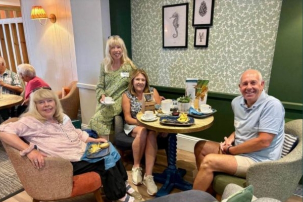 People enjoying The Coast Hoouse