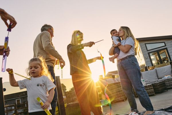 Family out on the lodge decking while sunsets