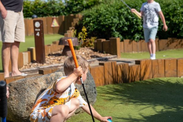 Children playing mini golf