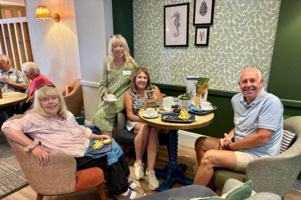 People enjoying the coast house breakfast