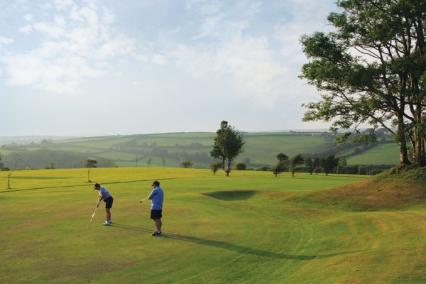Couple playing golf
