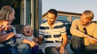 Family laughing on decking