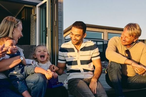 Family laughing on decking