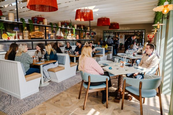 People dining in the compass